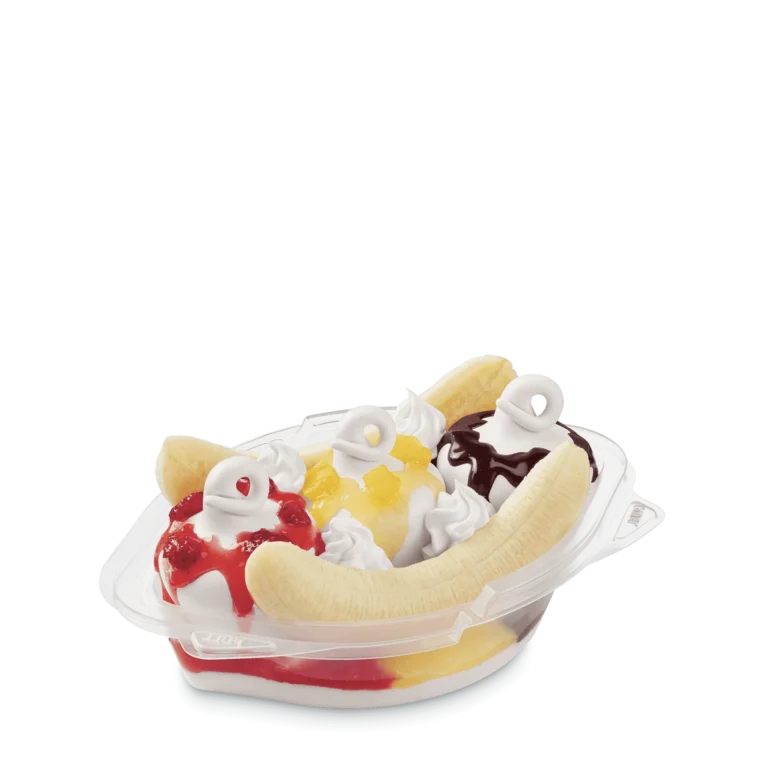 banana split with vanilla and chocolate soft serve, sauces, cherries, and banana halves