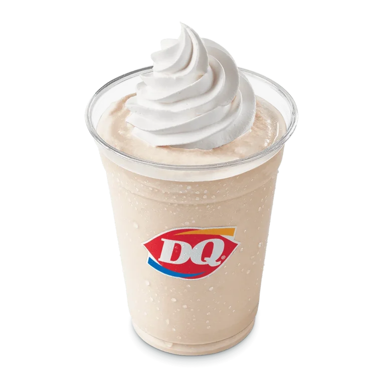 Caramel Shake in a clear cup topped with whipped topping