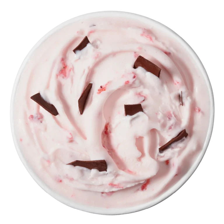 single red and white swirled Blizzard treat topped with chocolate chunks in a clear cup