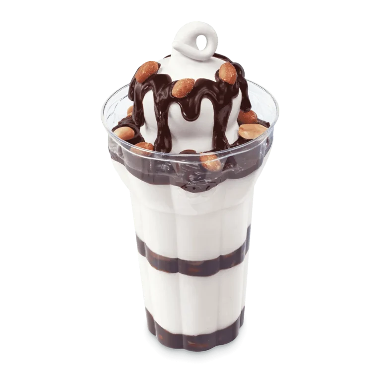 vanilla soft serve with chocolate topping and peanuts in a parfait cup
