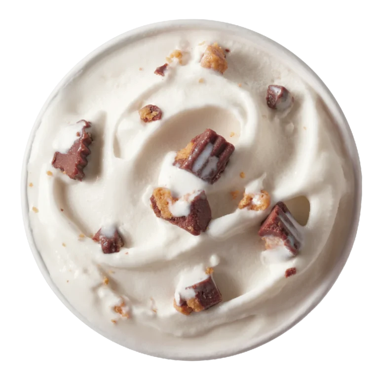 single Reese's Peanut Butter Cup Blizzard treat in clear cup with peanut butter cup pieces