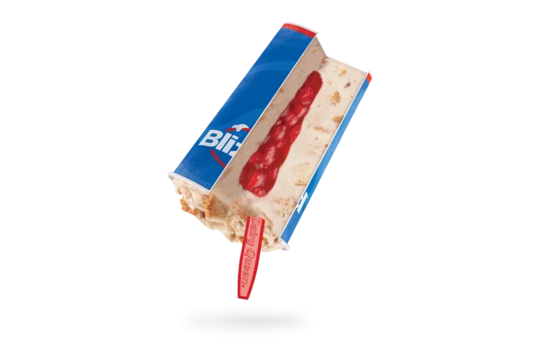 single Royal New York Cheesecake Blizzard in clear cup with cheesecake pieces and strawberry topping