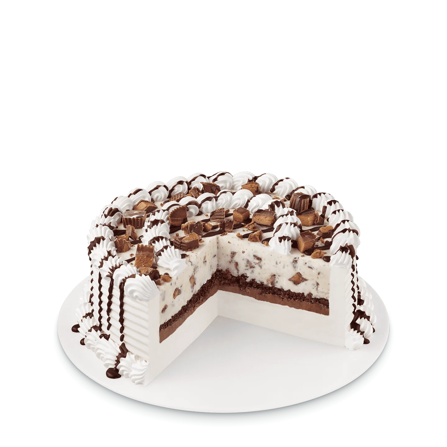 round cake with peanut butter cup pieces and peanut butter drizzle on top